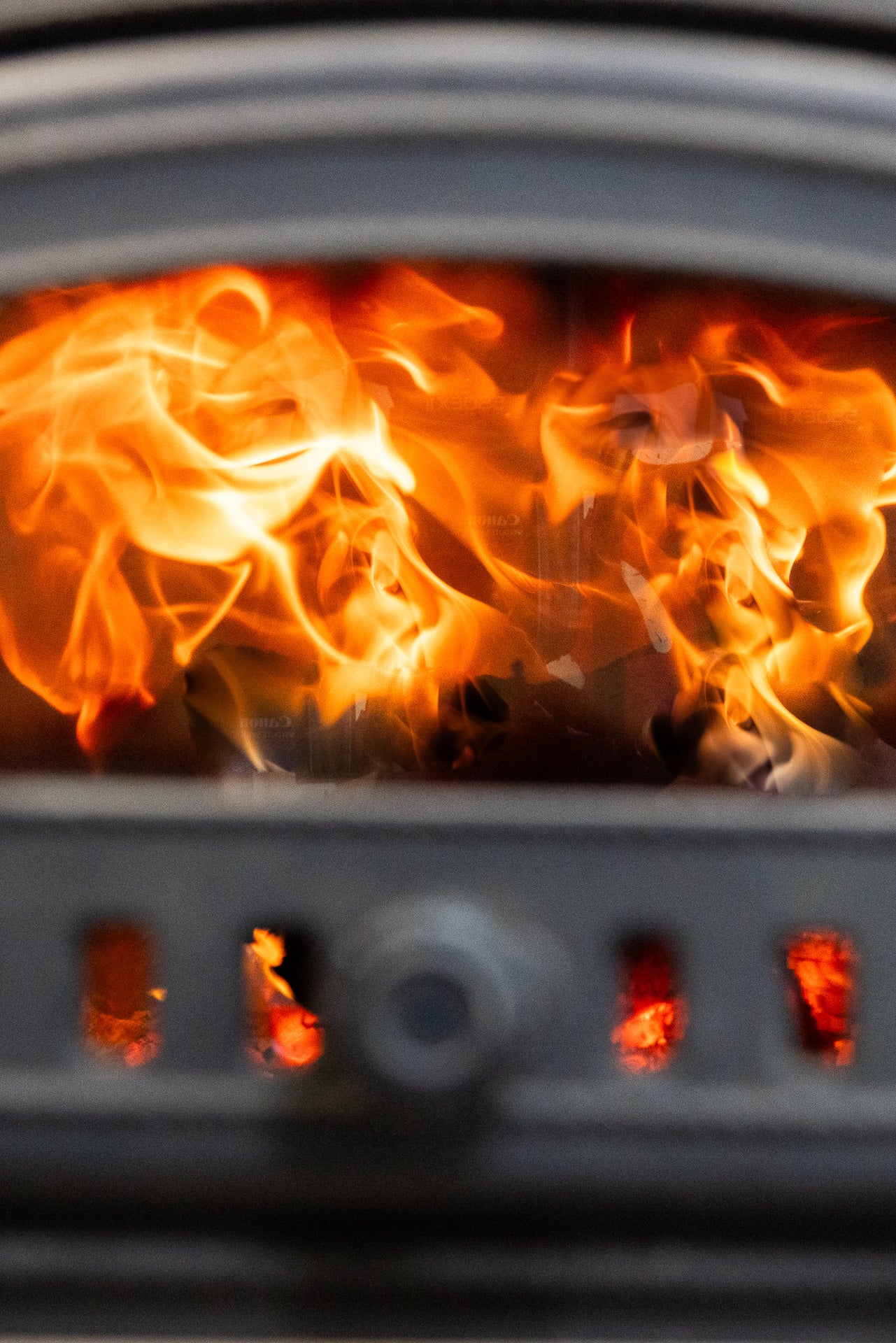 Flames roaring inside the wood-fired oven