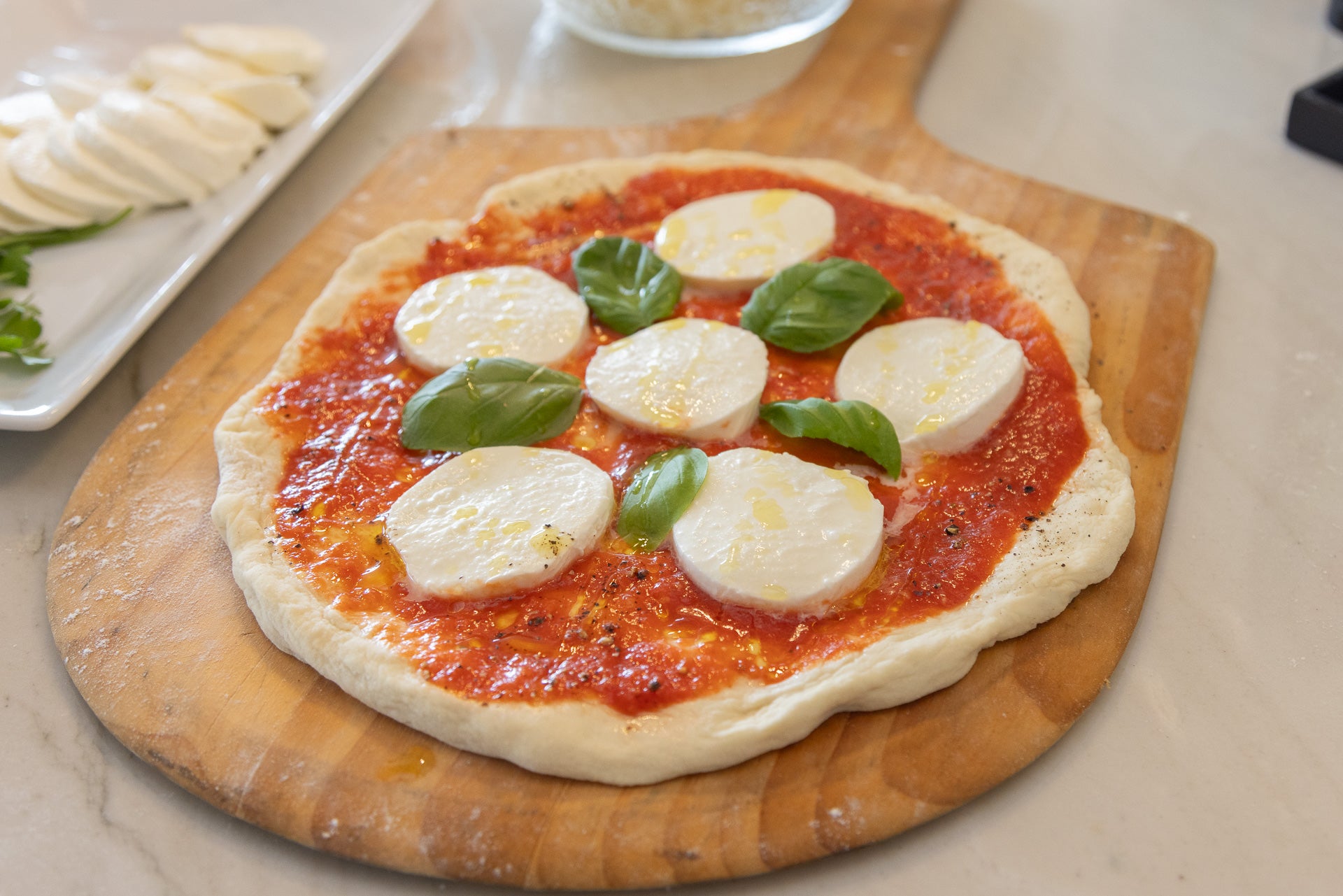 Wood-fired pizza fresh off the peel