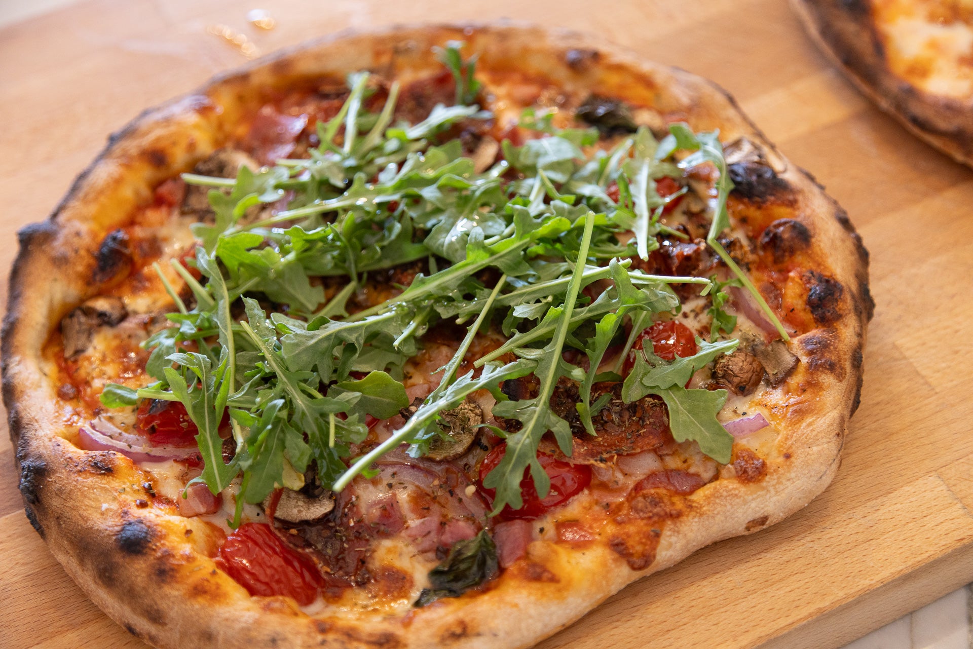 A wood-fired pizza fresh from the oven